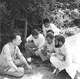 Horace Holmes, Chief of the Agricultural Group of the Point Four Program in India, speaks with Indians in Etawah