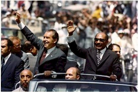 Richard Nixon and Anwar Sadat ride past cheering crowds in Alexandria, Egypt, June 1974. Provided by the Richard Nixon Presidential Library and Museum.